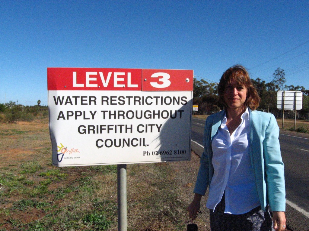 A picture of Anna next to a water restriction advisory sign, taken from our water policy trip to New South Wales in May 2010.