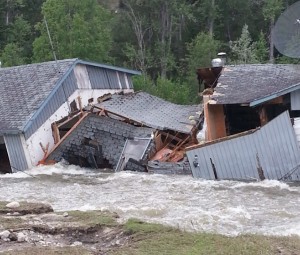 This house on Mission Creek was evacuated after being undermined in last year's freshet. This year's high water tore it apart